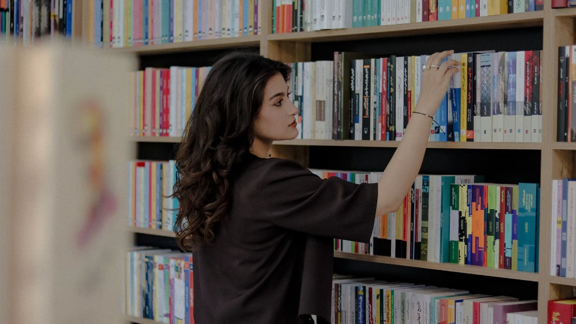 Woman exploring educational resources in a library